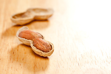 Image showing Peanuts on Wood Background