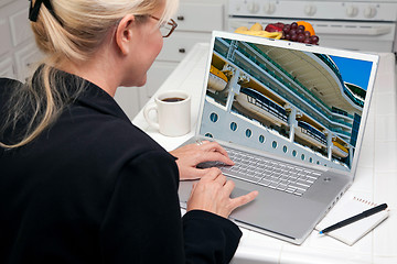 Image showing Woman In Kitchen Using Laptop- Cruise vacation