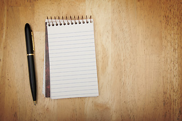 Image showing Note Pad and Pen on Wood