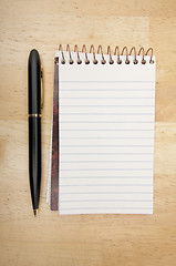 Image showing Note Pad and Pen on Wood