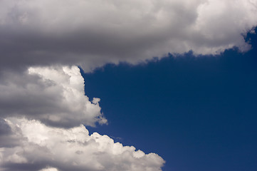 Image showing Puffy Clouds on a blue sky.