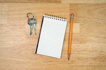 Image showing Pad of Paper, Pencil and Keys