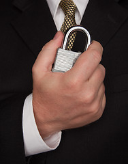 Image showing Businessman Holding Large Lock