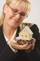 Image showing Woman Holding House