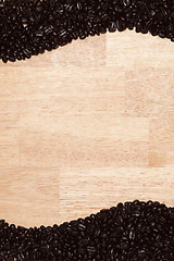 Image showing Dark Roasted Coffee Beans on Wood Background