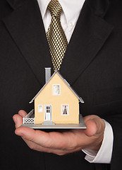 Image showing Businessman Holding House