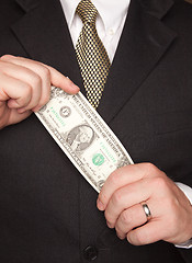 Image showing Businessman Holding Dollar Bill