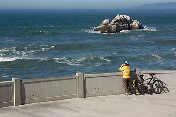 Image showing Bicyclist Rests Near Ocean