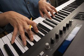 Image showing Woman's Fingers on Digital Piano Keys