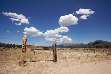 Image showing Aged Fence and Clouds