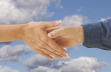 Image showing Man and woman shaking hands.