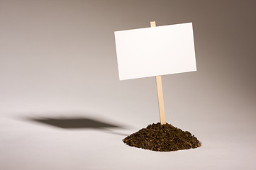 Image showing Blank White Sign in Dirt Pile