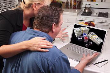 Image showing Couple In Kitchen Using Laptop - Online Poker