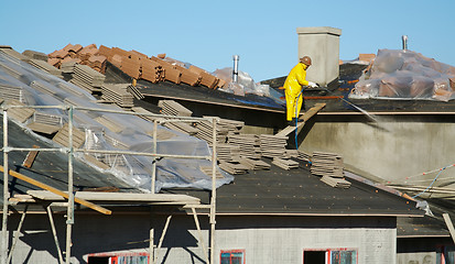 Image showing Construction Worker Pressure Washes 