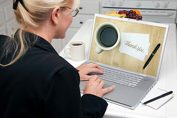 Image showing Woman In Kitchen Using Laptop - E-commerce