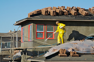 Image showing Construction Worker Pressure Washes 