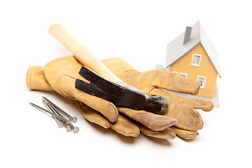 Image showing Hammer, Gloves, Nails and House