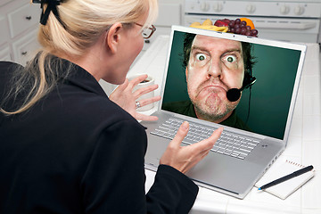 Image showing Excited Woman In Kitchen Using Laptop Ð Poor Custmer Support