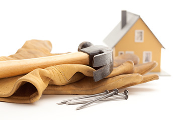 Image showing Hammer, Gloves, Nails and House