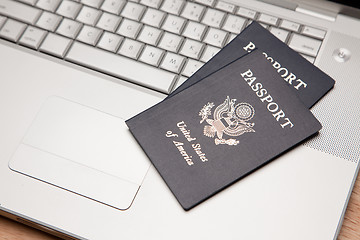 Image showing Passports on Laptop Keyboard