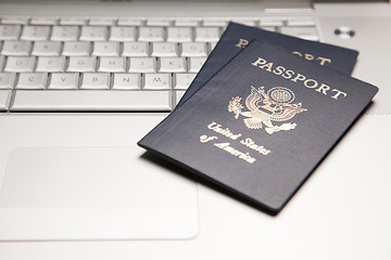 Image showing Passports on Laptop Keyboard