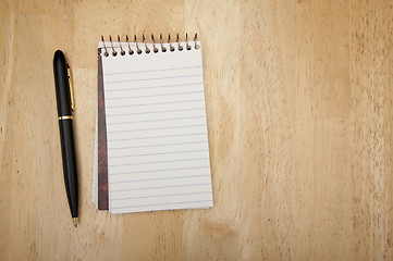 Image showing Note Pad and Pen on Wood