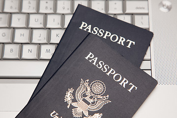 Image showing Passports on Laptop Keyboard