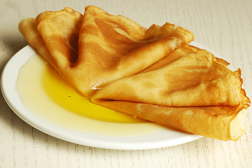 Image showing pancakes with honey