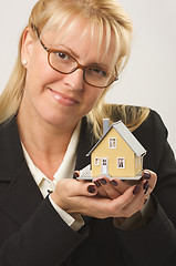 Image showing Woman Holding House