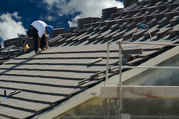 Image showing Roofer Laying Tile