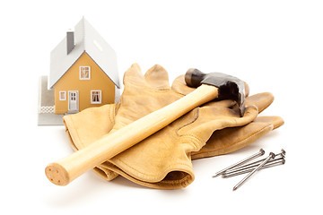 Image showing Hammer, Gloves, Nails and House