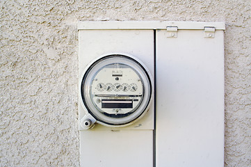 Image showing Electric Meter on Stucco Wall