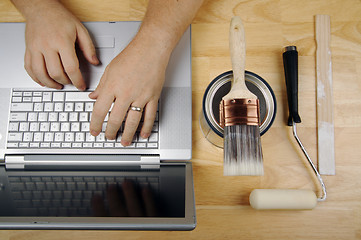 Image showing Handyman Using Laptop