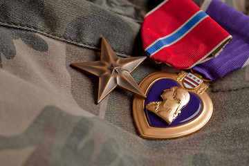 Image showing Bronze and Purple Heart Medals on Camouflage Material