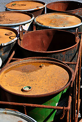 Image showing Old rusty waste barrels