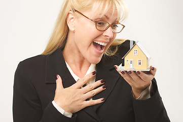 Image showing Excited Female Holding House