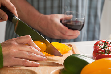 Image showing Woman Slicing Vegetables on Cutting Board