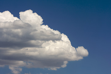 Image showing Puffy Clouds on a blue sky.