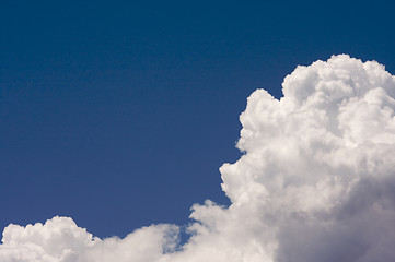 Image showing Puffy Clouds on a blue sky.