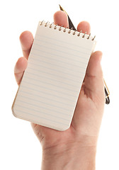 Image showing Male Hands Holding Pen and Pad of Paper