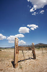 Image showing Aged Fence and Clouds