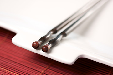 Image showing Wooden Chopsticks & White Plate