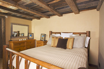 Image showing Luxurious Rustic Log Cabin Bedroom