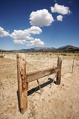 Image showing Aged Fence and Clouds