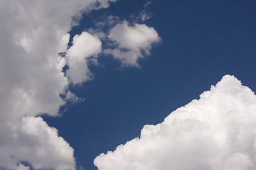 Image showing Puffy Clouds on a blue sky.