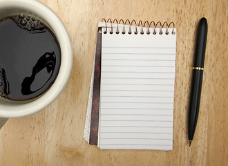 Image showing Note Pad Cup and Pen on Wood