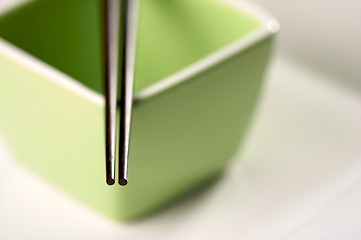 Image showing Chopsticks & Green Bowl