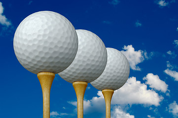 Image showing Three Golf Balls & Tees
