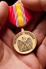 Image showing Man Holding National Defense War Medal