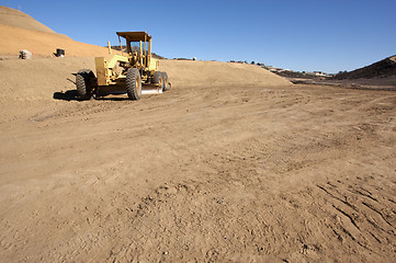 Image showing Tractor at a Construction Site and dirt lot.